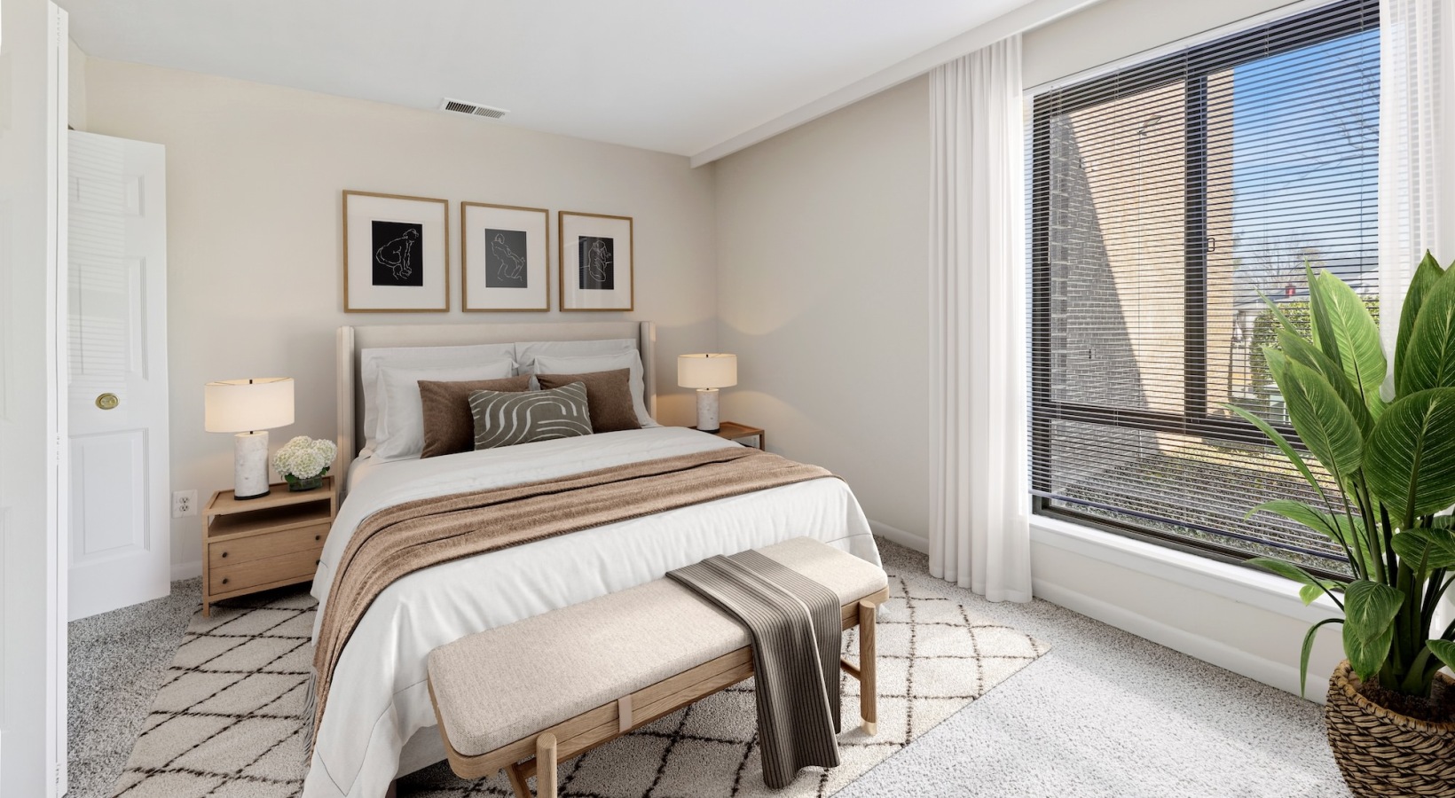 Bedroom with bed with tan blankets