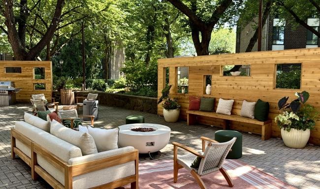 a patio with a pool and chairs