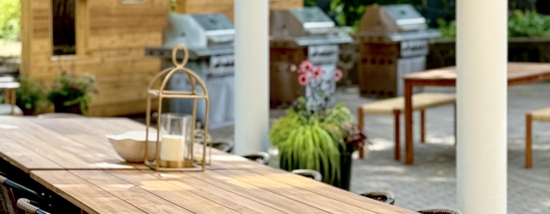 a table with a straw umbrella